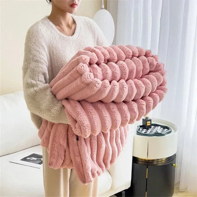 Elegant plush CozyWrap blanket for supreme warmth, adding luxury and comfort to any home decor.