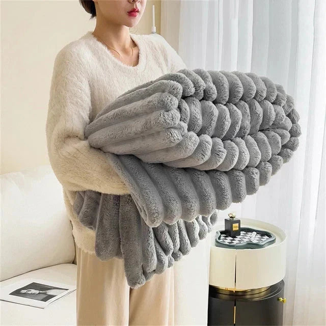 Unisex Luxe Comfort CozyWrap, a super soft plush blanket providing ultimate warmth and cozy relaxation.