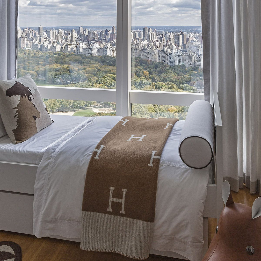 Premium cashmere wool throw blanket in a rich gold hue.