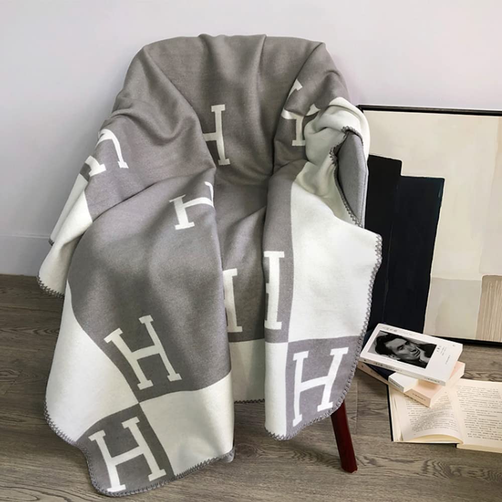 Elegant gold cashmere blend throw, perfect for stylish living spaces.