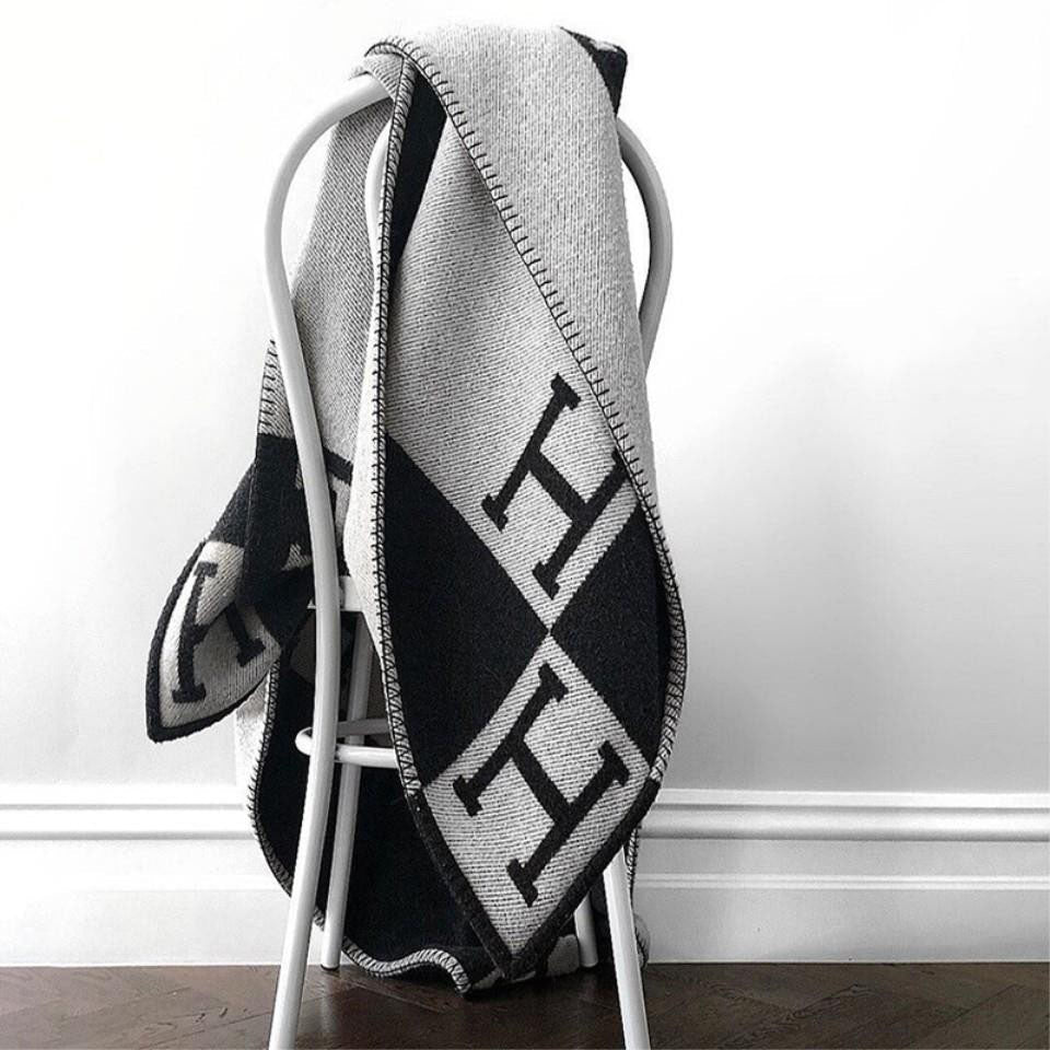 A beautiful gold throw blanket made from fine cashmere and wool.