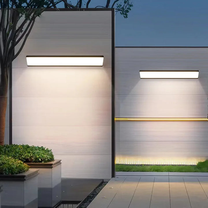 Modern LED wall lamp with a luxurious glow, durable aluminum fixture for outdoor spaces. Energy efficient patio light.