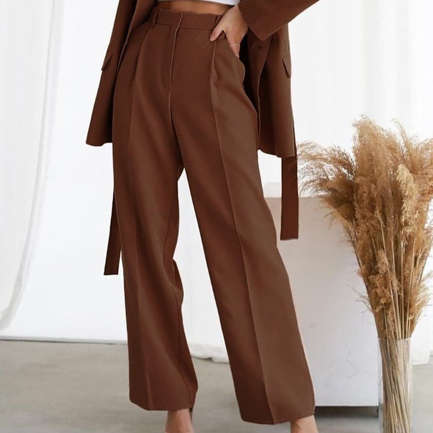 Elegant green high waist wide leg pleated pants for women, ideal for formal or casual outfits.