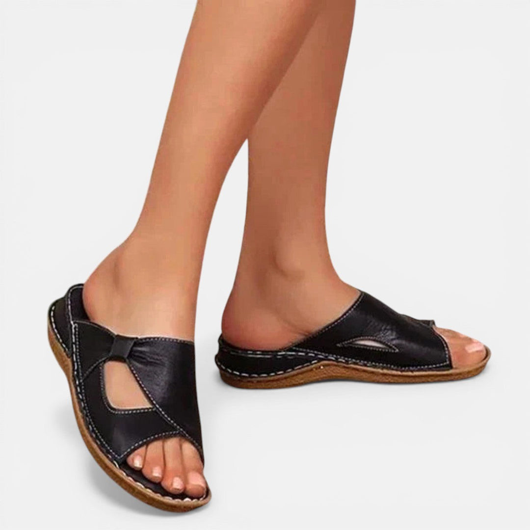Comfortable women's slip-on walking sandals with arch support, perfect for casual summer wear and long walks.