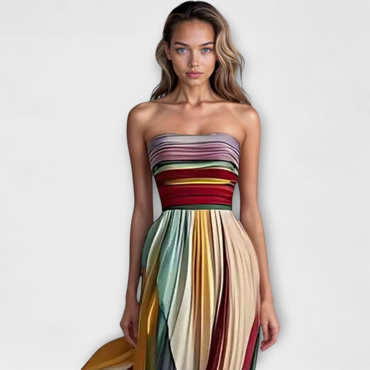 Chic women's strapless striped cocktail dress with pleated details & a ruffled hem for evening events.