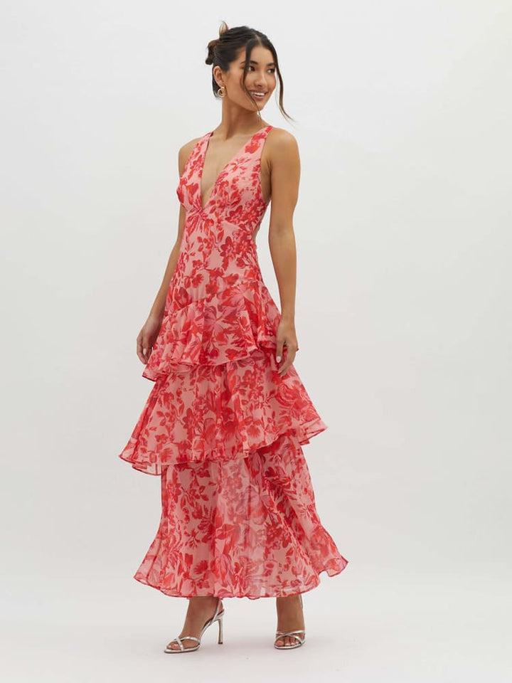 Polished women's floral tiered maxi dress. Elegant design with a plunging neckline, perfect for race days & special events.