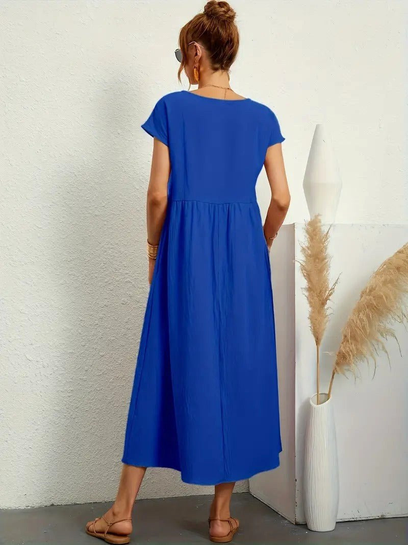 Women's Madison midi dress, a comfortable and elegant option with flowing fabric & pockets.