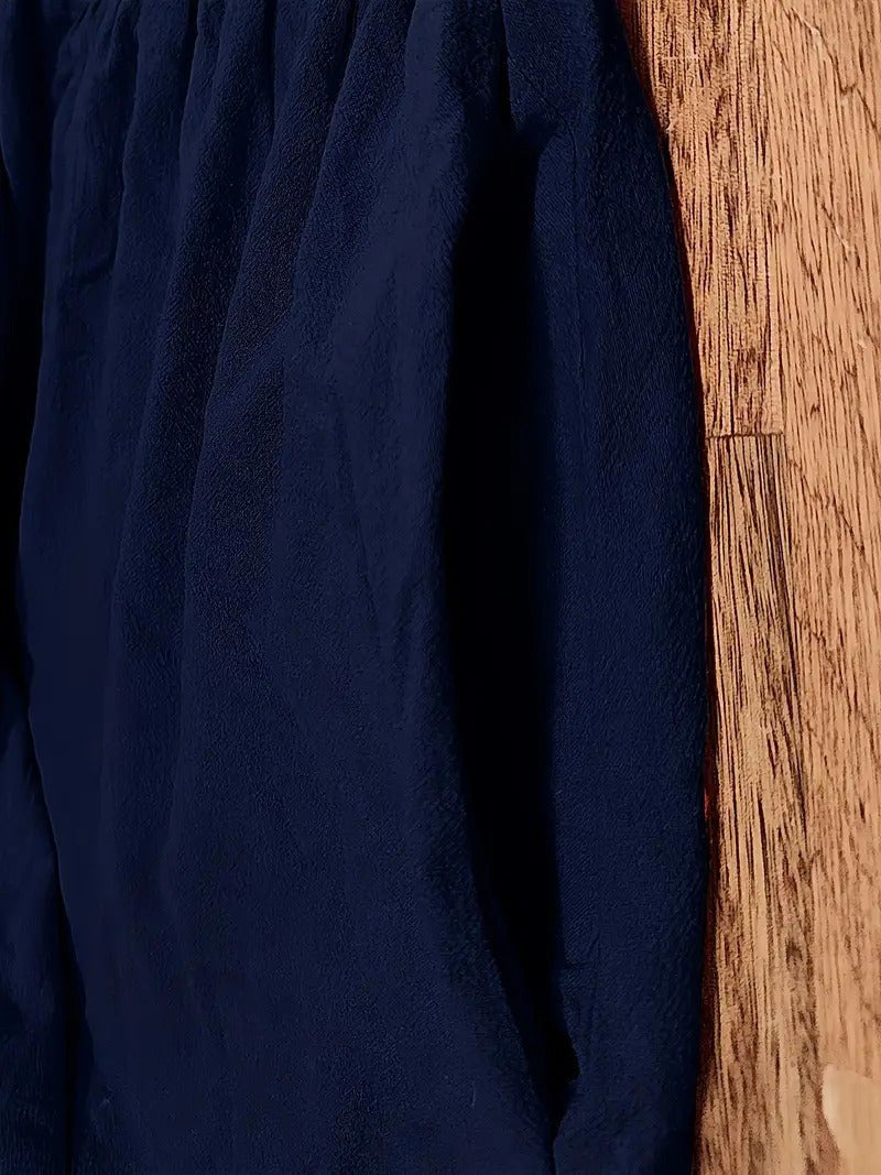 Women's flowing midi dress, elegant and practical, with convenient pockets.
