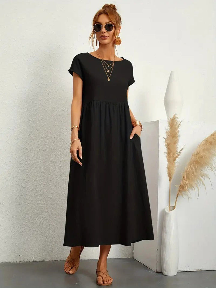Comfortable women's flowing midi dress, perfect for summer, with essential pockets.