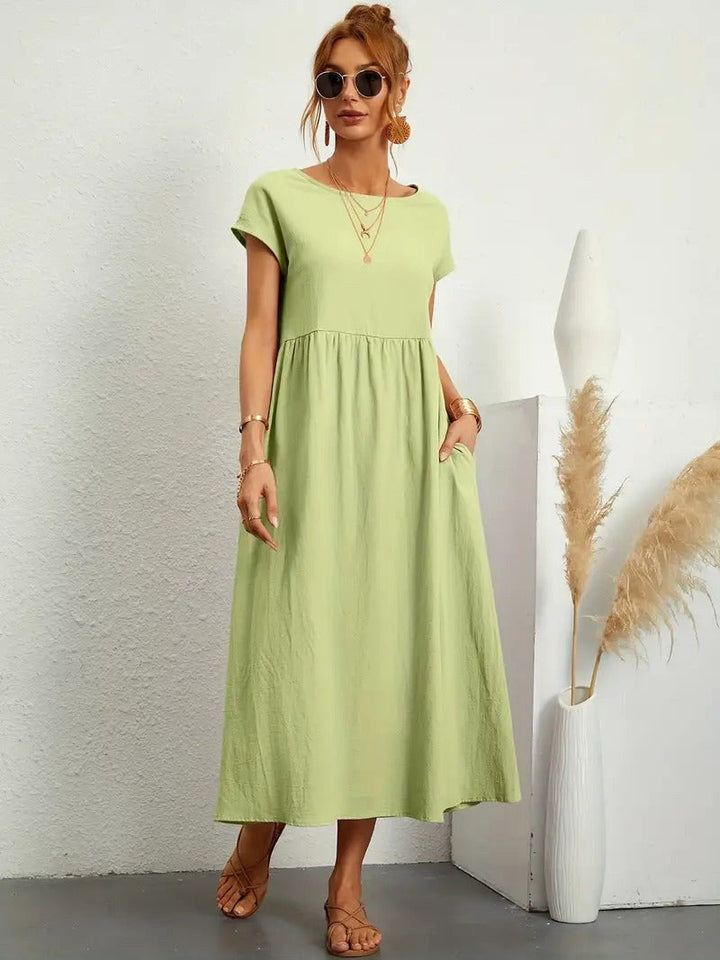 Women's Madison midi dress, a comfortable flowing option with pockets for everyday elegance.