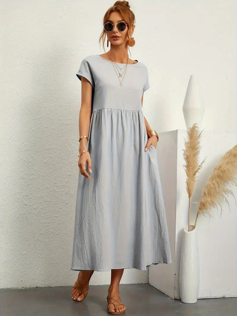 Casual women's flowing midi dress, Madison collection, with essential pockets for convenience.