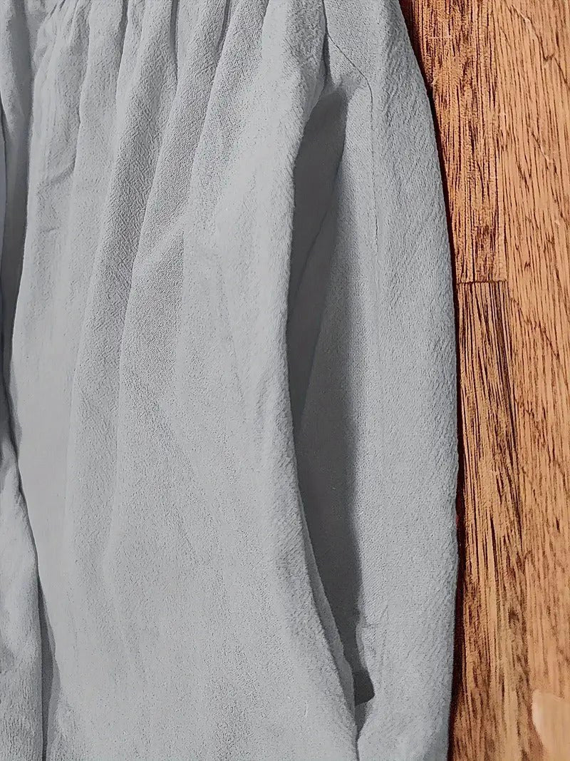 Elegant women's midi dress with a flowing skirt and practical pockets for a polished look.
