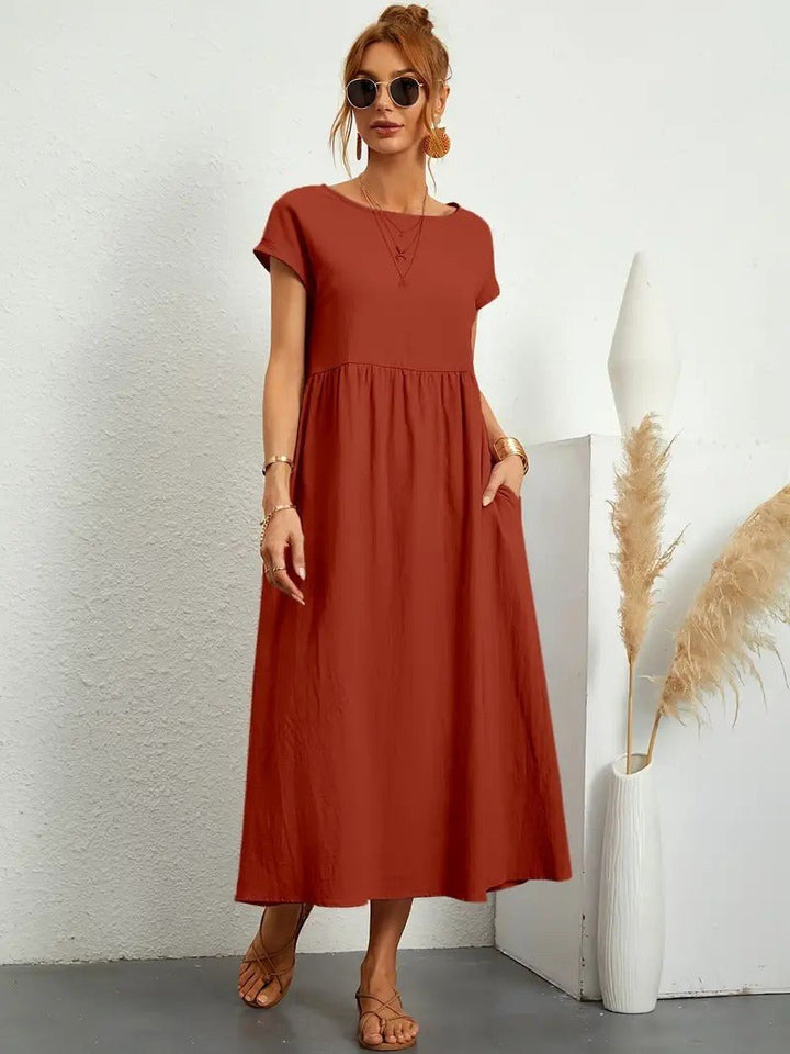 Comfortable women's Madison flowing midi dress, perfect for relaxed yet chic styling with pockets.