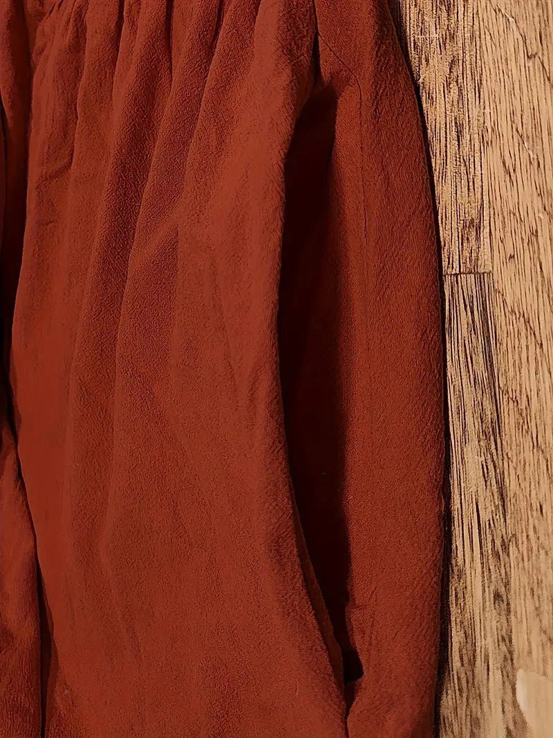 Women's flowing midi dress with pockets, a versatile fashion piece for all seasons.
