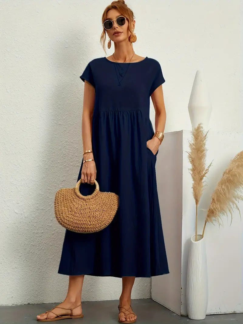 Comfortable Madison midi dress for women, featuring a flowing silhouette & convenient pockets.