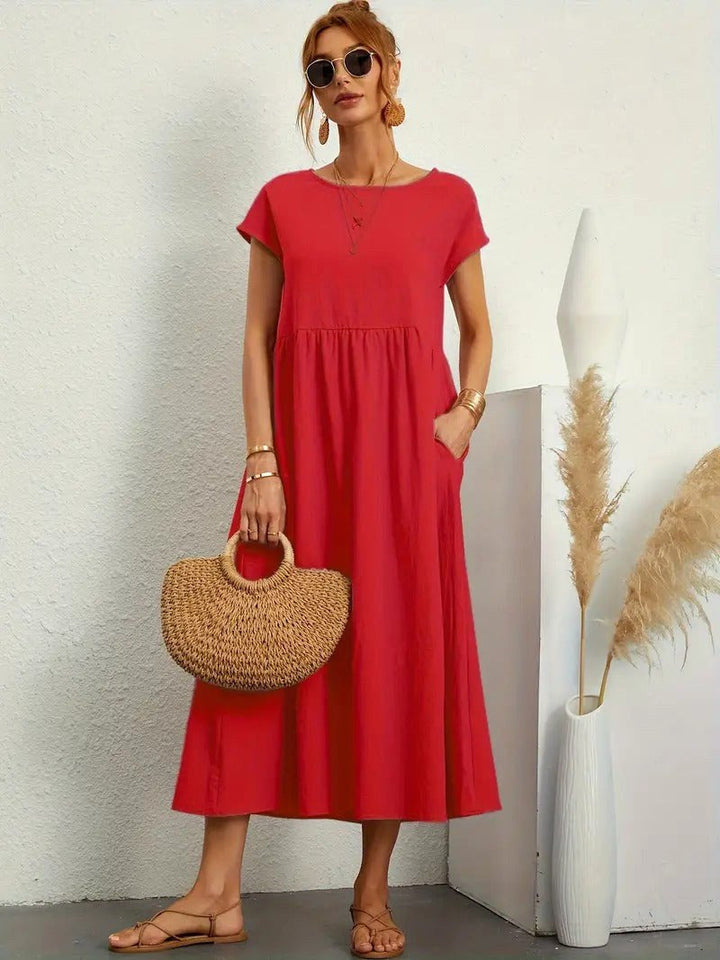 Fashionable women's flowing midi dress, Madison collection, with discreet pockets.