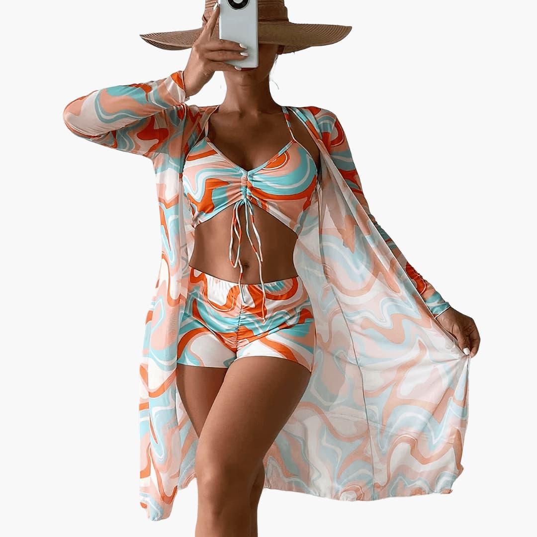 Women's vibrant swirl print 3-piece beach cover up set with kimono, crop top & high-waisted shorts.