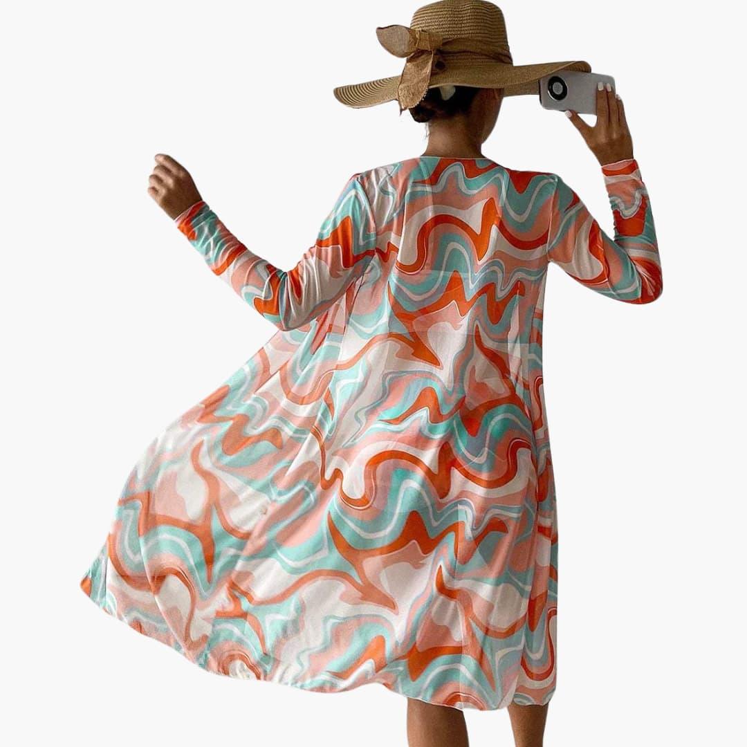 Stylish women's swirl print beach cover up set; a 3-piece kimono, crop top, and high-waisted shorts.
