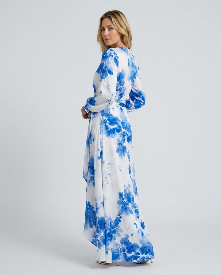 Flowy floral print maxi dress featuring elegant lantern sleeves and a flattering tie-waist. Ideal for race day.