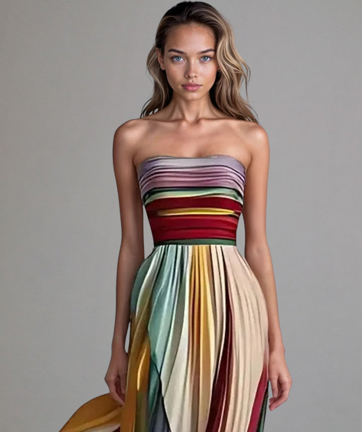 Elegant women's strapless pleated maxi dress, ideal for wedding guests & formal special occasions. Flowing design.