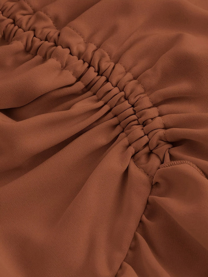 Elegant women's tiered midi skirt with flowing ruffle hem, ideal for a chic and feminine look.