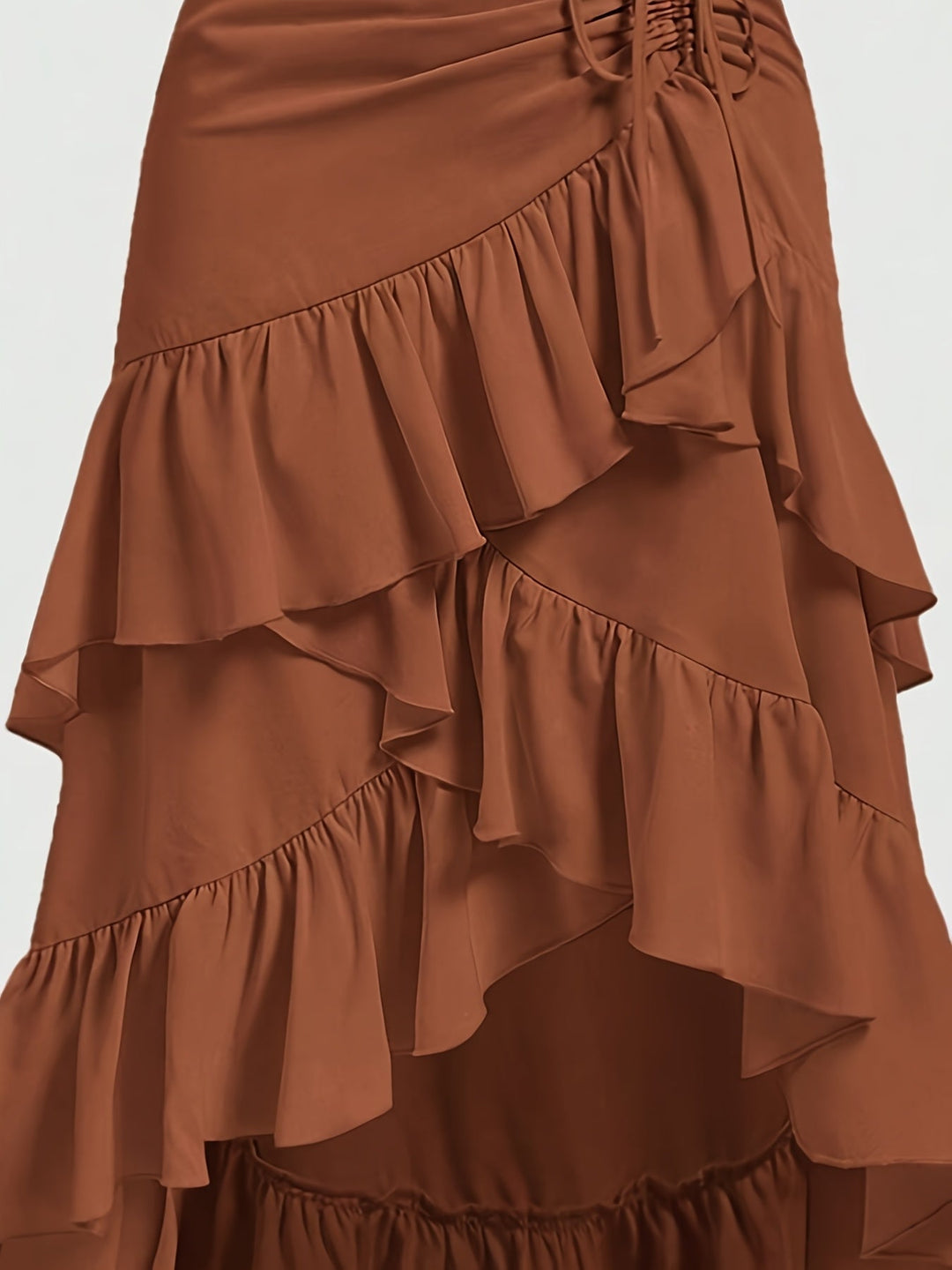 Close-up of the delicate tiered ruffles on a comfortable, flowy midi skirt for women.