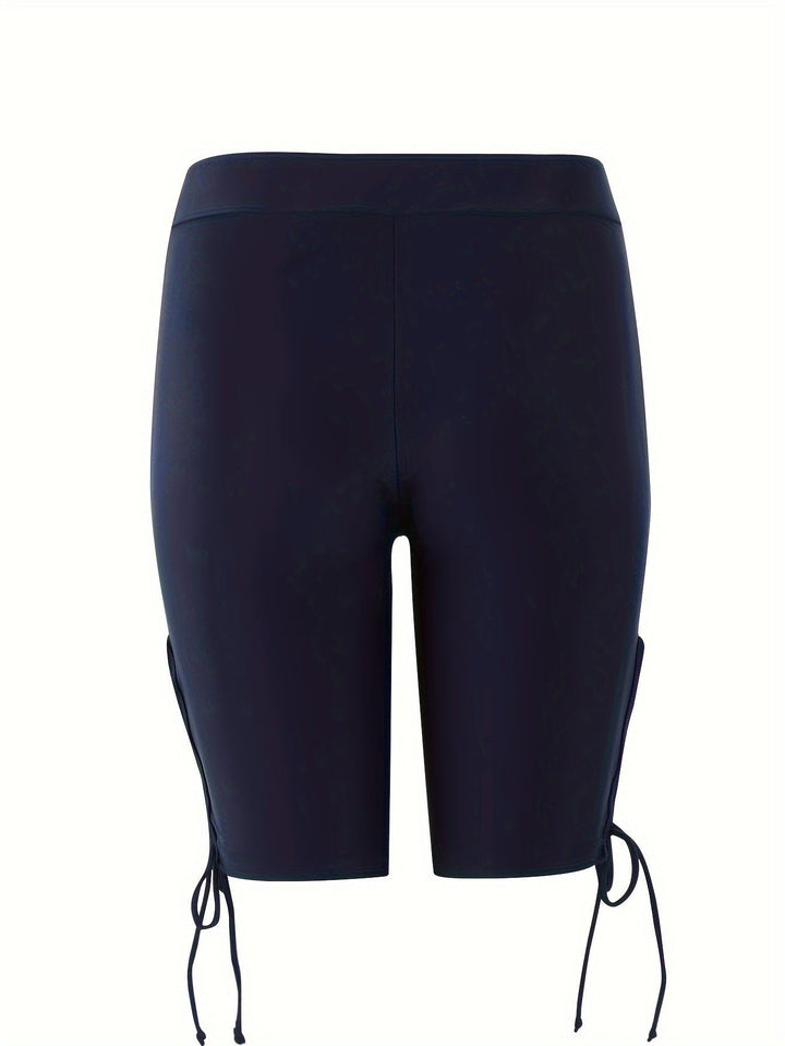 Active women's bike shorts with fashionable lace-up & cut-out accents. Great for summer activities and casual outfits.
