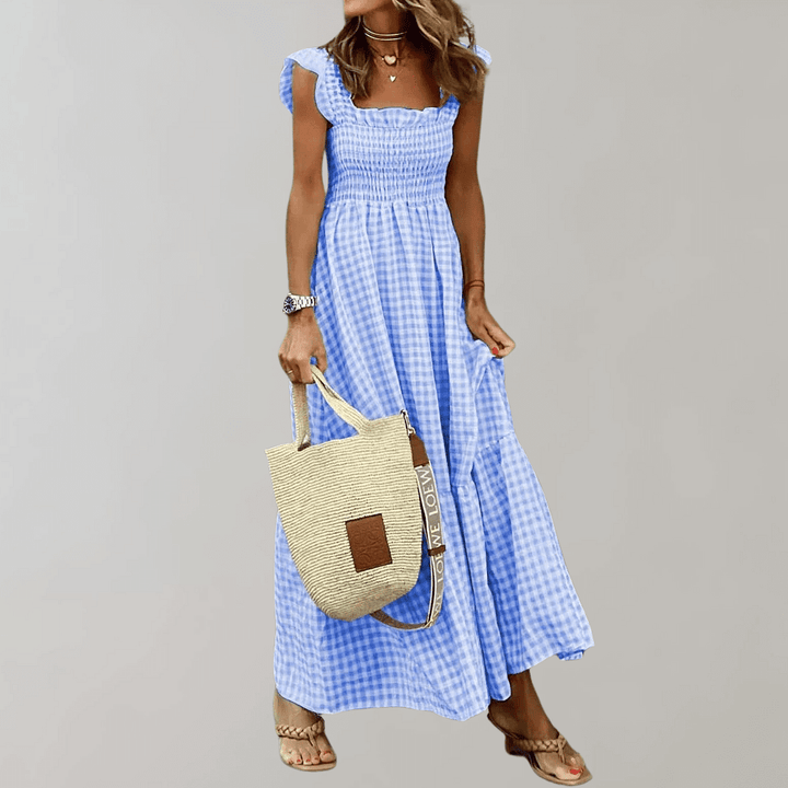 Chic women's smocked gingham maxi dress with a stylish tiered skirt, embodying casual elegance for summer.