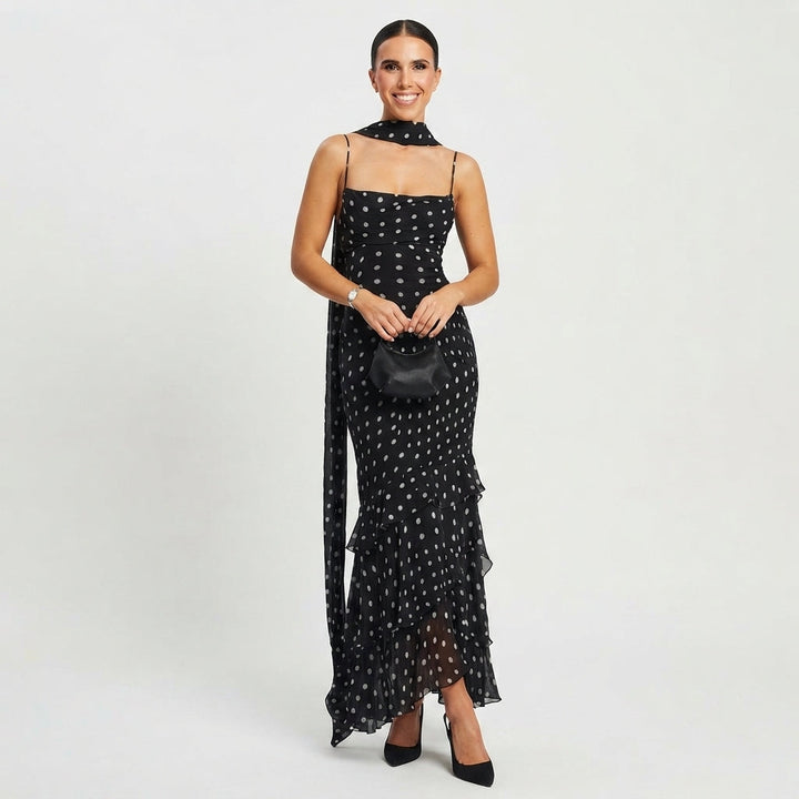 Elegant women's black polka dot tiered maxi dress, perfect for races or garden parties.