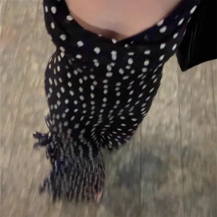 Flowy black polka dot tiered maxi dress for women, elegant and comfortable for races & summer events.