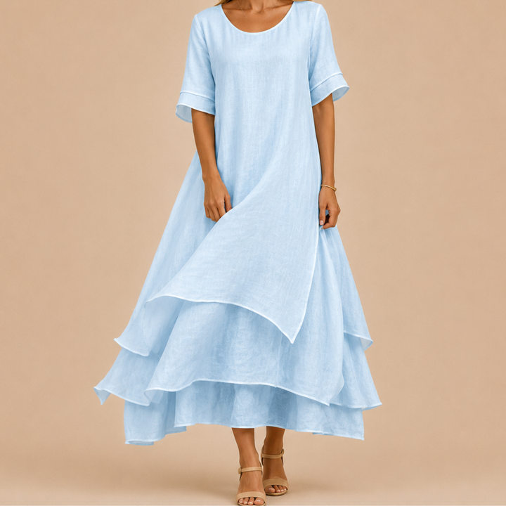 Purple elegant flowy tiered ruffle maxi dress, chic and comfortable for any summer occasion.
