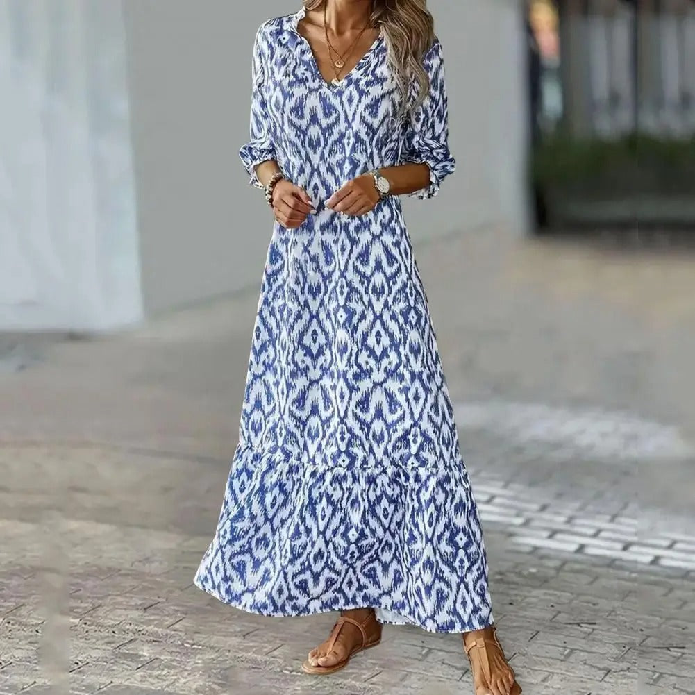 Elegant blue patterned flowy maxi dress for women, perfect for summer comfort & vacation.
