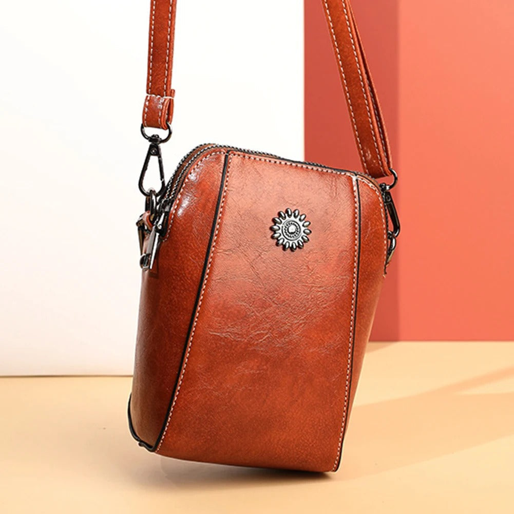 Green leather women's versatile shoulder bag, a chic everyday fashion accessory.