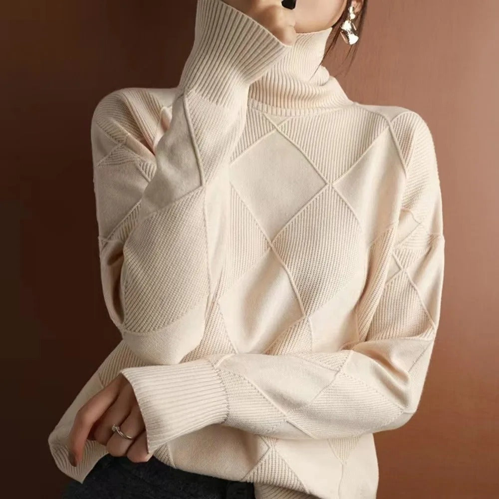 Cozy women's long-sleeve turtleneck pullover sweater, versatile for elegant fall and winter layering.