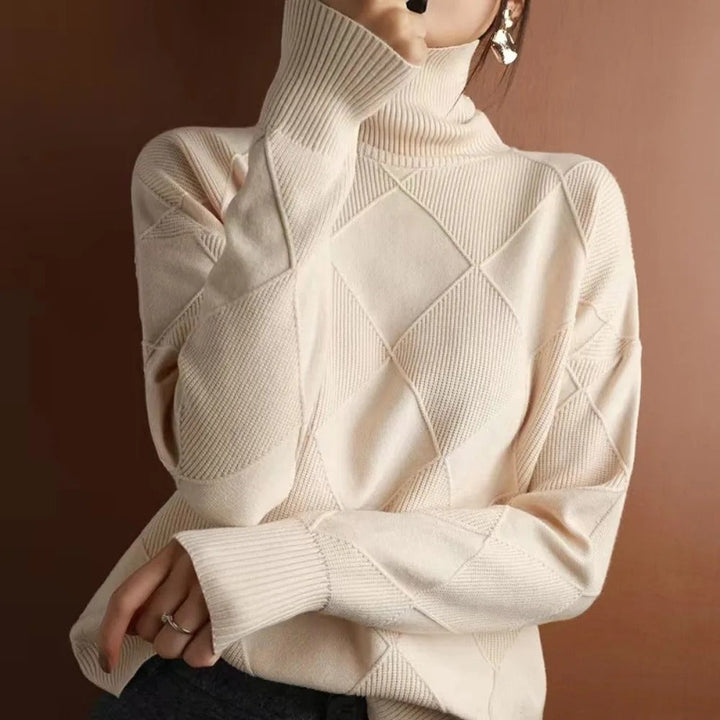 Cozy women's long-sleeve turtleneck pullover sweater, versatile for elegant fall and winter layering.