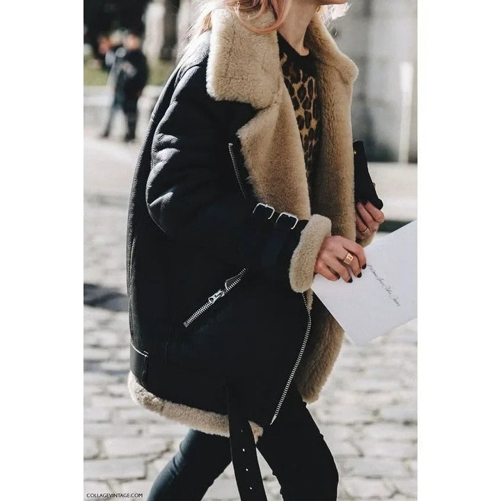 Women's stylish winter jacket with belt, offering warmth and handy pockets for colder days.
