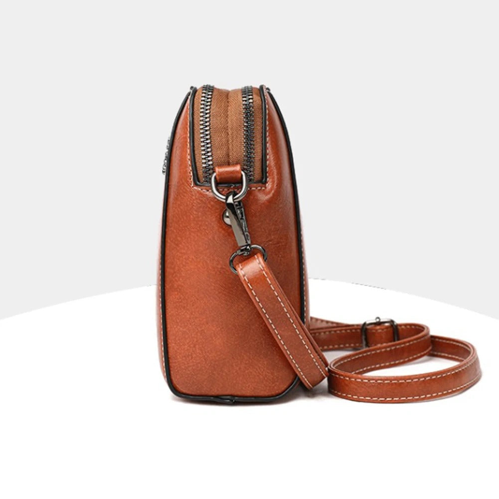 Red leather versatile shoulder bag for women, perfect stylish everyday fashion accessory.