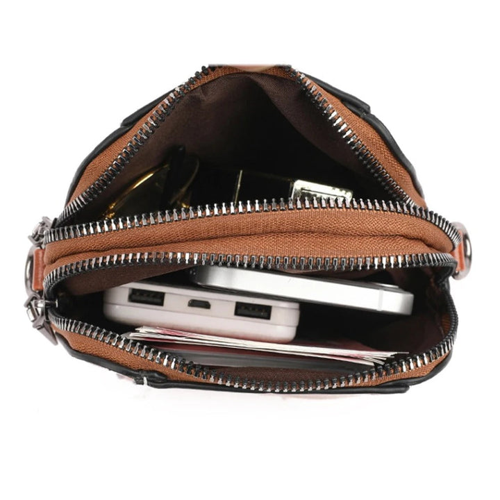 Classic black leather women's shoulder bag, stylish, versatile and an essential everyday handbag.