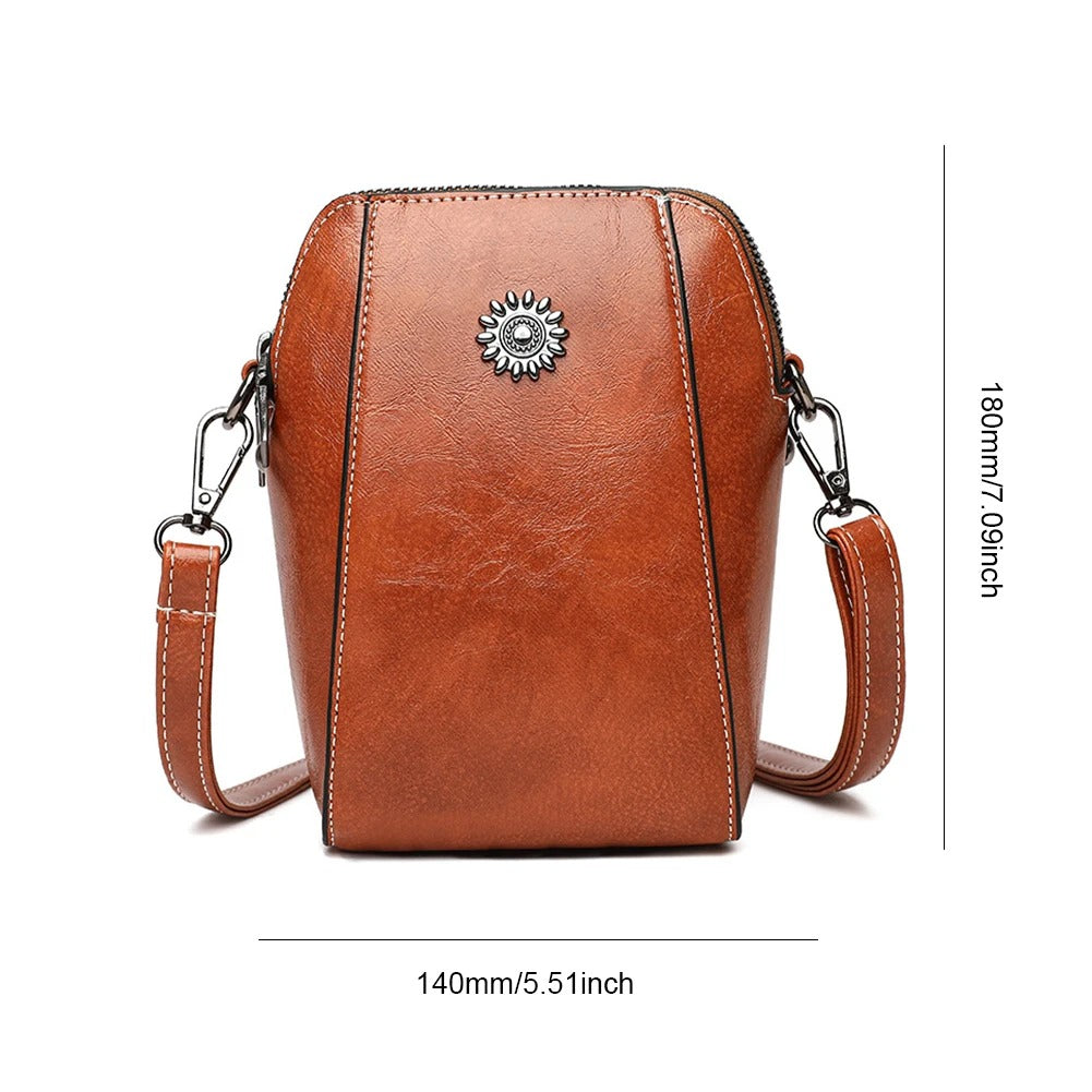 Stylish women's leather shoulder bag, versatile handbag with adjustable strap, available in multiple colors.