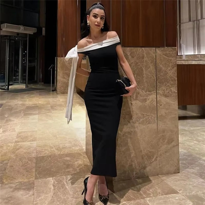 Stylish women's black off-shoulder midi party dress, exuding sophisticated elegance for special events.