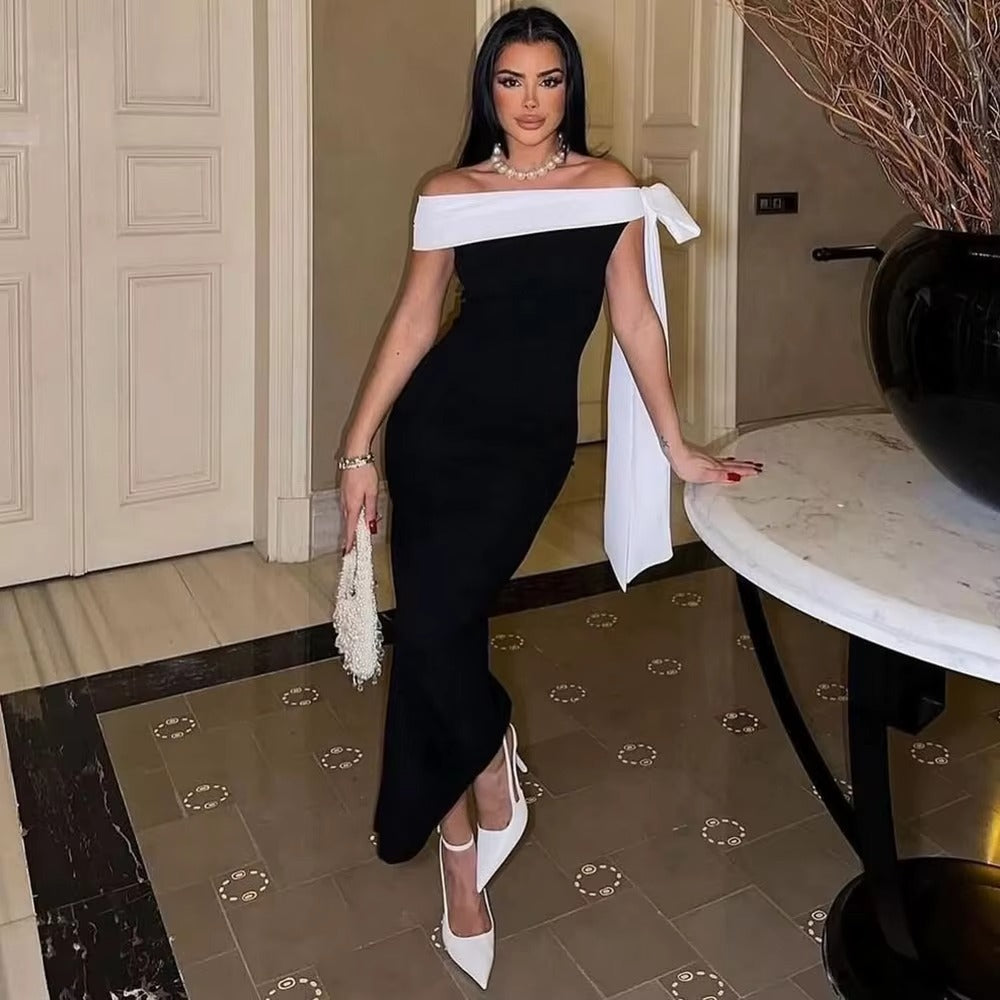 Sophisticated women's black off-shoulder midi dress, ideal formal wear for evening events.