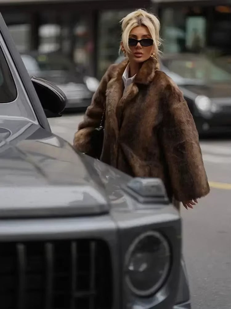 Warm dark brown women's long winter coat, offering luxurious style and comfort for elegant cold weather fashion.