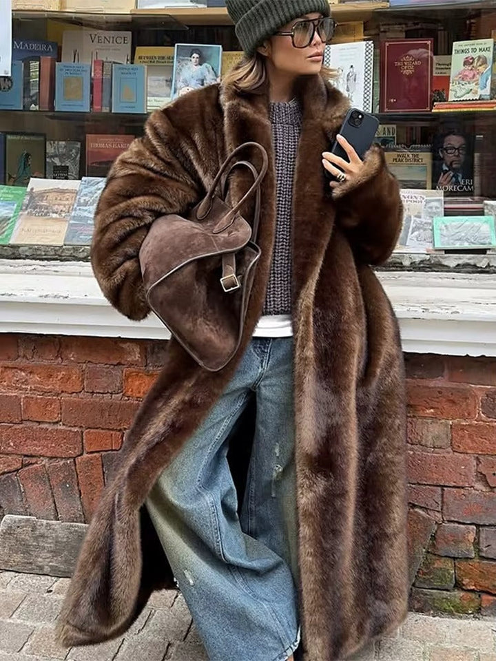 Elegant dark brown women's long luxury winter coat, warm and sophisticated outerwear for cold weather.