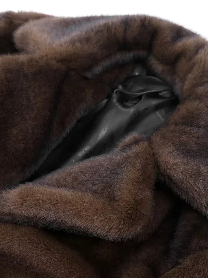 Long dark brown women's luxury winter coat, elegant and warm outerwear, essential for sophisticated cold weather.