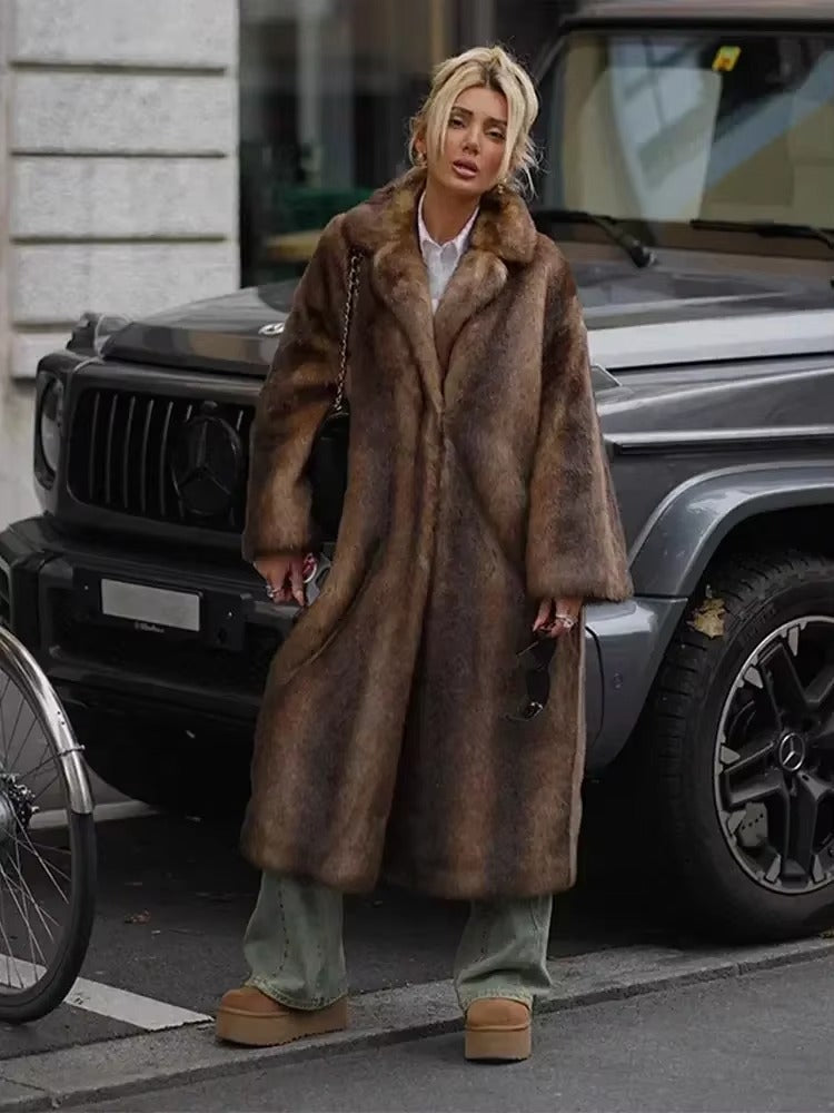 Dark brown luxury women's long winter coat, oversized for warmth, elegant and sophisticated cold weather outerwear.