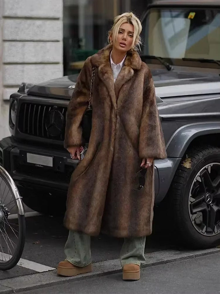 Dark brown luxury women's long winter coat, oversized for warmth, elegant and sophisticated cold weather outerwear.
