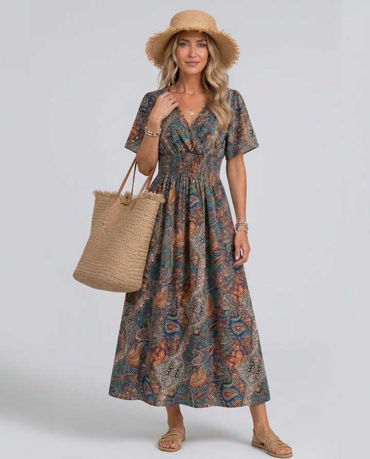 Women's smocked waist boho maxi dress, paisley print, V-neck, summer fashion.