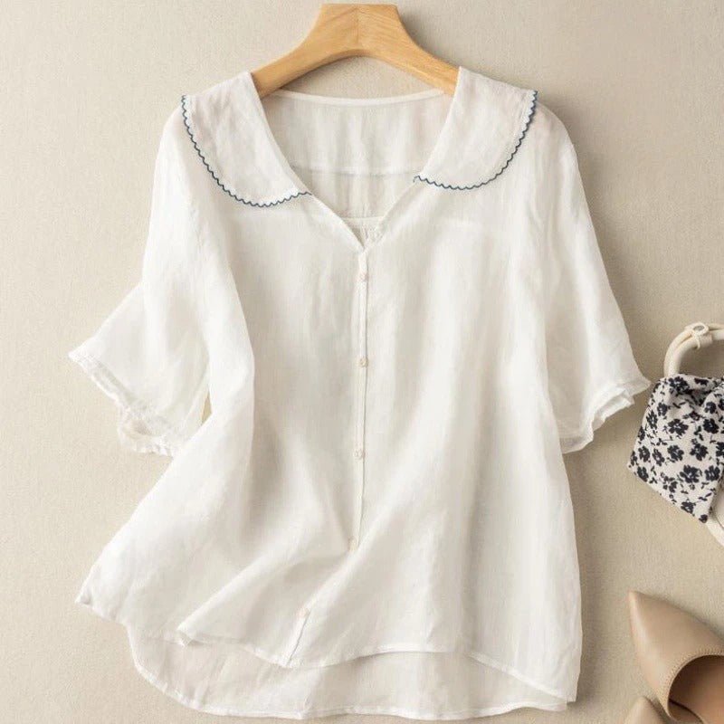 Stylish women's half-sleeve blouse featuring a graceful scalloped collar and button-up front. Elegant & versatile.