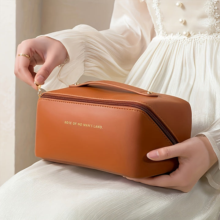 Luxury travel makeup organizer bag with zipper, water-resistant PU leather for women's toiletries.