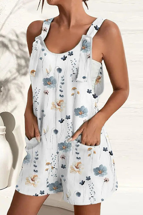 Effortless women's summer fashion: a vibrant wide-leg jumpsuit with adjustable straps & discreet pockets.
